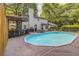 Inviting backyard pool with wooden deck, bar and outdoor seating, perfect for relaxing and entertaining at 1615 Arden Sw Dr, Marietta, GA 30008