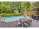 Relax in this large pool surrounded by wooden decking and lush foliage at 1615 Arden Sw Dr, Marietta, GA 30008