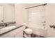 Well-lit bathroom with a granite countertop vanity and a shower-tub combination at 33 Oxford Ln, Kingston, GA 30145