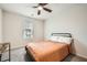 Inviting bedroom with a ceiling fan, plush carpeting, and natural light from the window at 33 Oxford Ln, Kingston, GA 30145