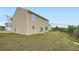 Rear view of a two-story house showcasing a well-maintained lawn and a patio area at 33 Oxford Ln, Kingston, GA 30145