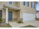 Inviting front entrance with a well-maintained lawn, and a two-car garage at 33 Oxford Ln, Kingston, GA 30145