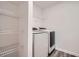 Functional laundry room with modern appliances and ample shelving for organized storage at 33 Oxford Ln, Kingston, GA 30145