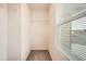 Walk-in closet with a window, offering a naturally lit space for organizing your wardrobe at 33 Oxford Ln, Kingston, GA 30145