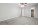 A spacious bedroom with neutral walls, gray carpet and a walk-in closet at 3335 New Heritage Dr, Alpharetta, GA 30022