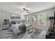 Serene bedroom with neutral tones, plush carpet, ceiling fan, and sunlit windows at 3335 New Heritage Dr, Alpharetta, GA 30022