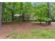 Charming home nestled among mature trees, creating a private and serene atmosphere at 3335 New Heritage Dr, Alpharetta, GA 30022