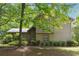 Exterior shot of home featuring lush landscaping and mature trees at 3335 New Heritage Dr, Alpharetta, GA 30022
