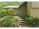 Inviting front entrance with brick steps and lush landscaping creates a warm welcome at 3335 New Heritage Dr, Alpharetta, GA 30022