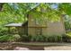 Charming front exterior of a well-maintained home surrounded by mature trees and landscaping at 3335 New Heritage Dr, Alpharetta, GA 30022
