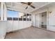 Covered back porch features a ceiling fan and access to the home's interior at 3775 Reston Ln, Decatur, GA 30034