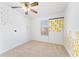 Bedroom with neutral carpet, ceiling fan, and playful decorations on the walls at 3775 Reston Ln, Decatur, GA 30034