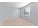 Bedroom with neutral carpet, window, and light gray walls at 3775 Reston Ln, Decatur, GA 30034
