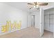 Bedroom with neutral carpet, ceiling fan, and storage closet at 3775 Reston Ln, Decatur, GA 30034