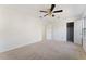 Large bedroom with neutral carpet, closet, and a ceiling fan at 3775 Reston Ln, Decatur, GA 30034