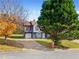 Two-story home featuring a charming design, an attached garage, and lovely yard with mature trees at 3775 Reston Ln, Decatur, GA 30034