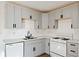 Modern kitchen with updated white countertops, stainless steel appliances, and lots of natural light at 3775 Reston Ln, Decatur, GA 30034