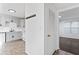 Bright kitchen with white cabinets, modern appliances, and sleek finishes adjacent to the entryway at 3775 Reston Ln, Decatur, GA 30034