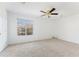 Main bedroom with neutral carpet, ceiling fan, and large window at 3775 Reston Ln, Decatur, GA 30034