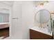 Stylish powder room with modern vanity, unique fixtures, and decorative lighting at 9950 Farmbrook Ln, Johns Creek, GA 30022