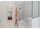 Updated bathroom featuring modern soaking tub and new fixtures at 9950 Farmbrook Ln, Johns Creek, GA 30022