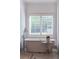 Freestanding white bathtub with floor mounted faucet in bright bathroom at 9950 Farmbrook Ln, Johns Creek, GA 30022