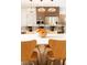 A kitchen with a center island and modern lighting at 9950 Farmbrook Ln, Johns Creek, GA 30022