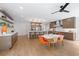 Bright kitchen with center island, stainless appliances, and open floor plan at 9950 Farmbrook Ln, Johns Creek, GA 30022