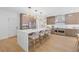 Bright kitchen features a large island and stainless steel appliances at 9950 Farmbrook Ln, Johns Creek, GA 30022