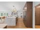 Bright and modern kitchen with a large center island and hardwood floors at 9950 Farmbrook Ln, Johns Creek, GA 30022