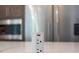 Modern kitchen counter features a pop-up power outlet, perfect for convenient access to electricity at 9950 Farmbrook Ln, Johns Creek, GA 30022