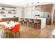 Bright, open kitchen with quartz countertops, modern appliances, and stylish seating at the breakfast bar at 9950 Farmbrook Ln, Johns Creek, GA 30022