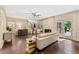 Cozy living room with fireplace and hardwood floors, adjacent to kitchen and backyard at 9950 Farmbrook Ln, Johns Creek, GA 30022