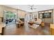 Bright living room with fireplace, hardwood floors, and access to backyard at 9950 Farmbrook Ln, Johns Creek, GA 30022