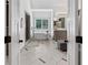 Bright and open main bathroom featuring a soaking tub, a glass shower and double vanity at 9950 Farmbrook Ln, Johns Creek, GA 30022
