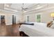 Large main bedroom features trey ceiling, walk-in closet, hardwood floors and natural light at 9950 Farmbrook Ln, Johns Creek, GA 30022