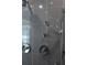Close-up of modern shower hardware and gray tiled wall at 9950 Farmbrook Ln, Johns Creek, GA 30022
