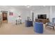 Spacious basement with carpeting, a mounted TV, and neutral paint at 11660 Crabapple Rd, Roswell, GA 30075
