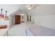 Bright and spacious bedroom with guitars mounted on the wall, high ceilings, and neutral decor at 11660 Crabapple Rd, Roswell, GA 30075
