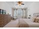 Bright bedroom with light carpet, a ceiling fan, and lots of natural light at 11660 Crabapple Rd, Roswell, GA 30075