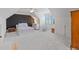 Large bedroom featuring a black accent wall, white walls, a ceiling fan, and a bed with white bedding at 11660 Crabapple Rd, Roswell, GA 30075