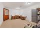 Versatile bonus room featuring built-in shelving and ample seating at 11660 Crabapple Rd, Roswell, GA 30075