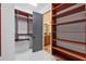 Well-organized walk-in closet with custom shelves and ample storage space at 11660 Crabapple Rd, Roswell, GA 30075