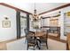 Cozy dining room with hardwood floors and a charming chandelier at 11660 Crabapple Rd, Roswell, GA 30075