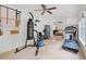 Well-equipped exercise room with various fitness machines and natural light at 11660 Crabapple Rd, Roswell, GA 30075