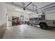 Spacious garage featuring ample storage and room for a truck at 11660 Crabapple Rd, Roswell, GA 30075