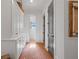 Hallway with brick floors and white built-in cabinets at 11660 Crabapple Rd, Roswell, GA 30075