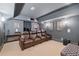 Comfortable home theater with leather recliners and dim lighting at 11660 Crabapple Rd, Roswell, GA 30075