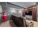 Cozy home theater includes a popcorn machine and tiered seating at 11660 Crabapple Rd, Roswell, GA 30075