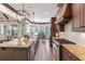 Gourmet kitchen with large island, granite countertops, and stainless steel appliances at 11660 Crabapple Rd, Roswell, GA 30075